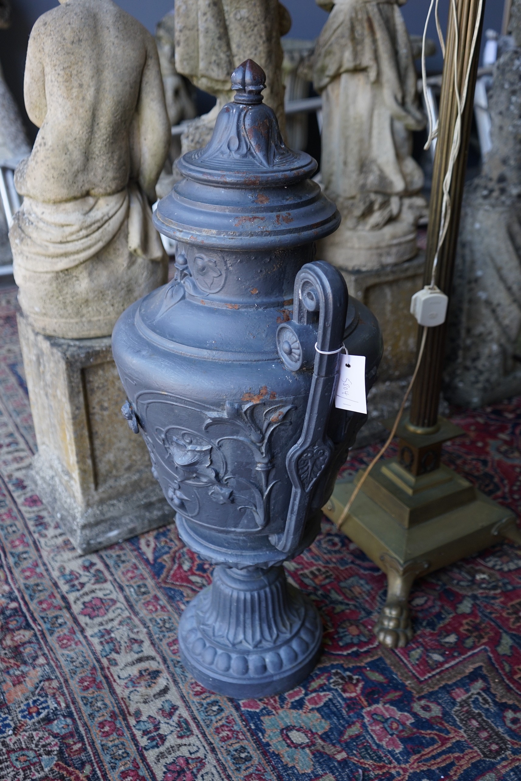 A painted cast iron two handled garden urn, height 80cm